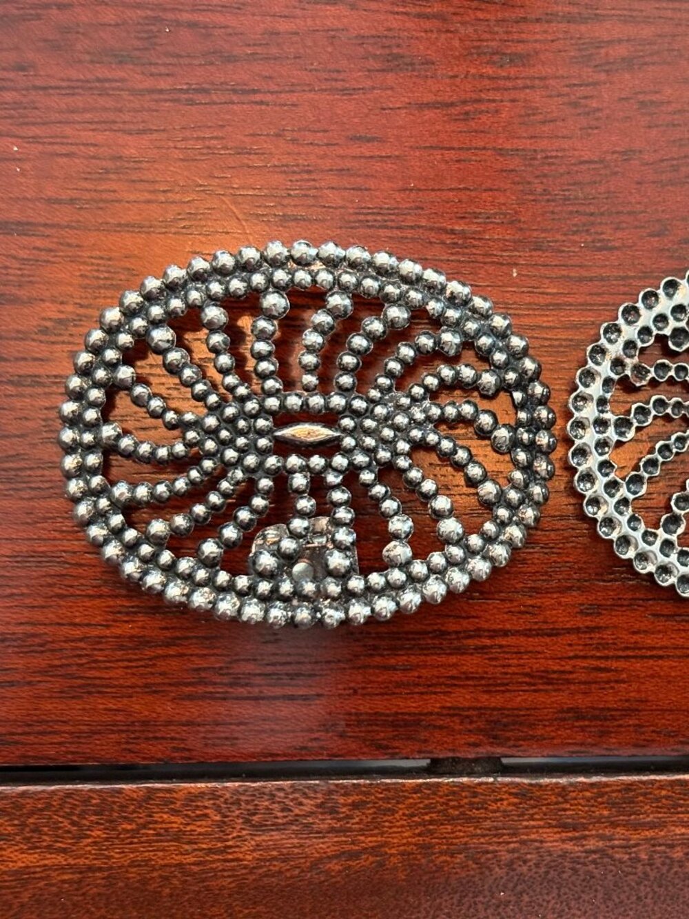 Pair of vintage Sarah Coventry silver-tone filigree brooches